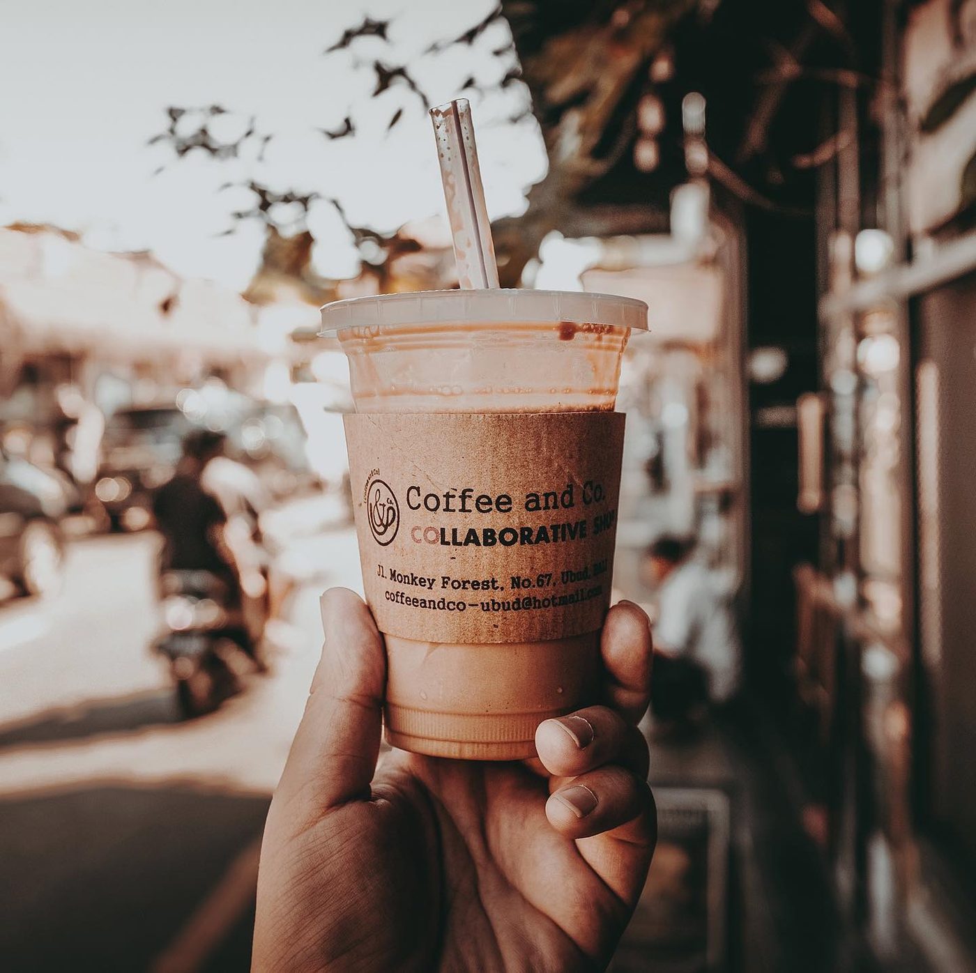 Hand-held iced coffee on the street